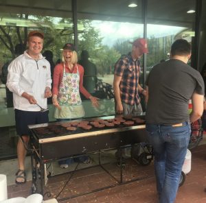 a photo of students grilling hamburgers