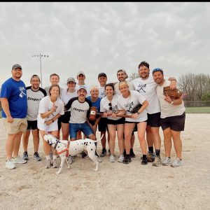 a photo of students after playing a softball game