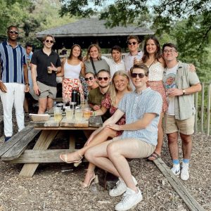 a photo of students sitting at a picnic table