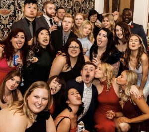 a big group photo of students at the barrister ball in formal wear