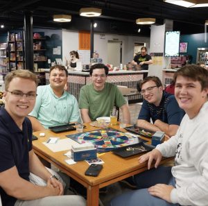 a photo of students playing a board game